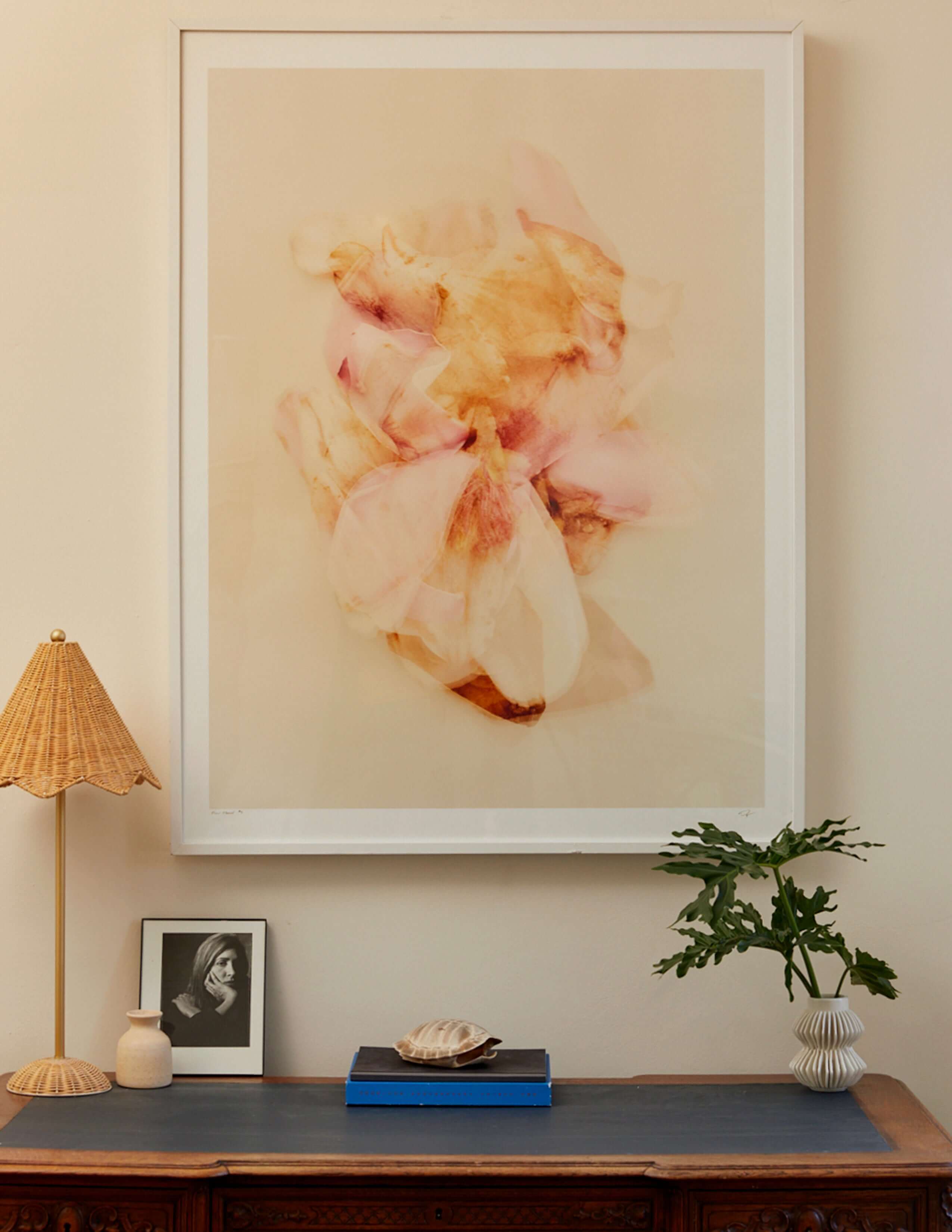 Floral Movements print hanging on a wall above a table
