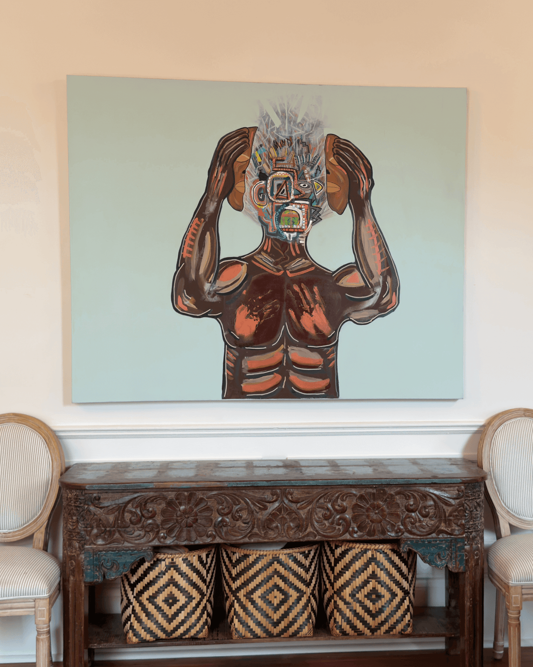 The painting Reveal by Brian Smyre hanging on a wall in a New Orleans home